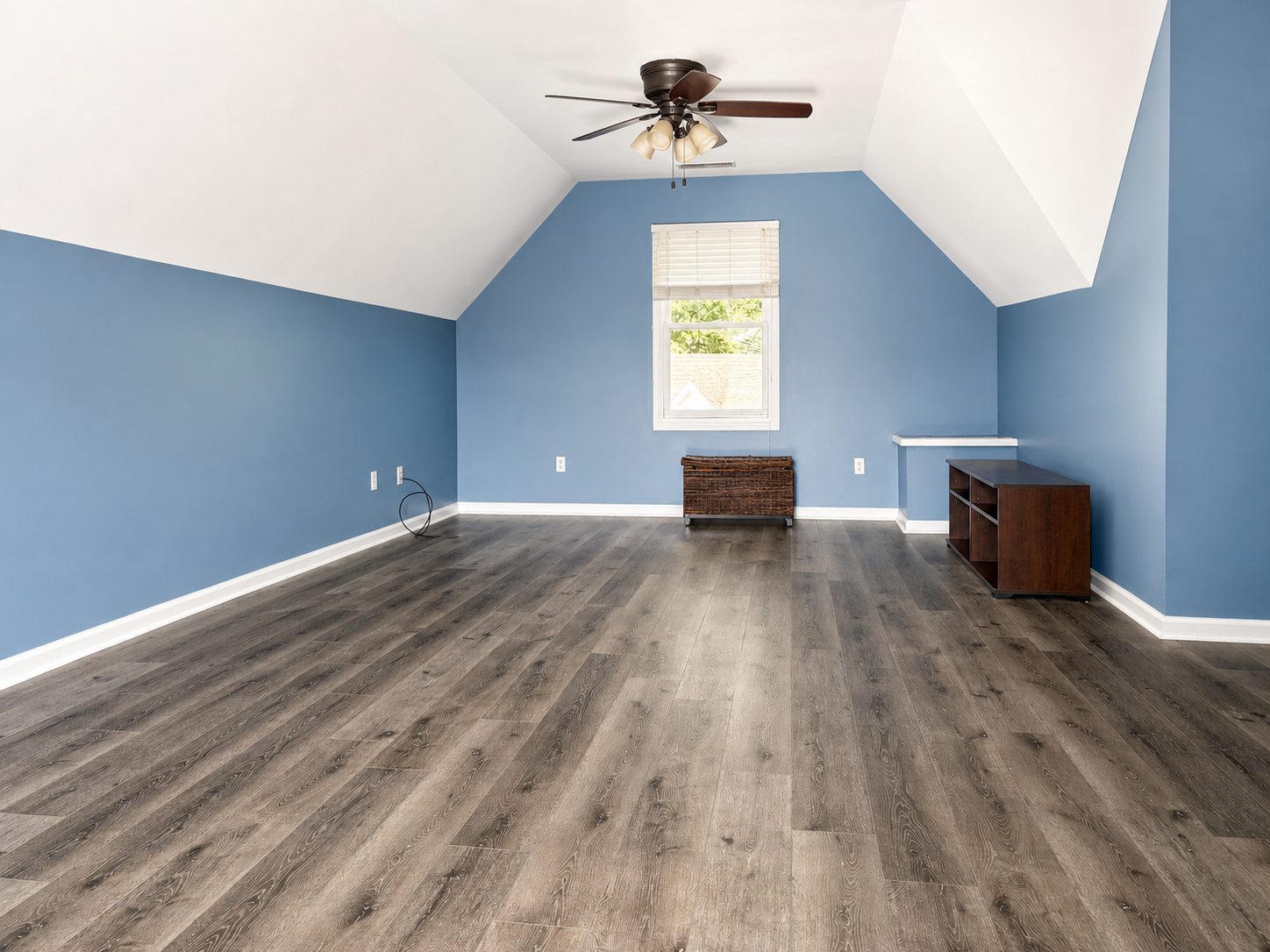 Polished bonus room photo from one end of the room