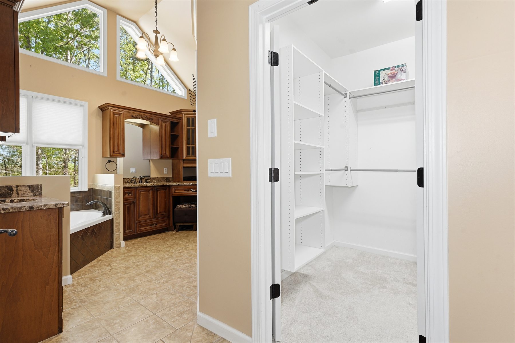 Primary bathroom view toward the walk-in closet